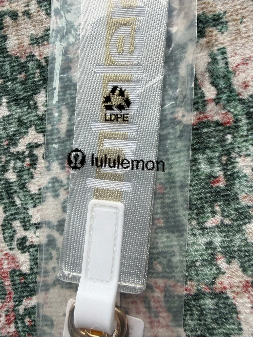 lululemon athletica Never Lost Keychain Lanyard in light grey with Gold Logo